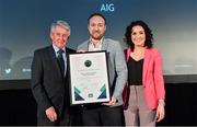 15 April 2019; AIG Head of Direct Marketing and Sponsorship, John Gillick, centre, and Rebecca Claffey, AIG Marketing Executive, are presented with the Social Media Award, sponsored by Pitchero, by Roddy Guiney, Chairperson of the Federation of Irish Sport, during the Irish Sport Industry Awards presented by the Federation of Irish Sport at Crowne Plaza Blanchardstown. Photo by Sam Barnes/Sportsfile