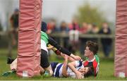 17 April 2019; Conor Martin of North Midlands scores his side's first try despite the efforts of Kyle Sheehy of Midlands during the U16 Bank of Ireland Leinster Rugby Shane Horgan Cup Final Round match between North Midlands and Midlands at Cill Dara RFC in Dunmurray West, Kildare. Photo by Eóin Noonan/Sportsfile