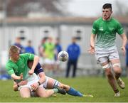 17 April 2019; Jamie Cooper of South East offloads to team-mate Joshua McAlister as he is tackled by Oisin Linnane of Metropolitan during the U18 Bank of Ireland Leinster Rugby Shane Horgan Cup - Final Round match between South East and Metropolitan at IT Carlow in Moanacurragh, Carlow. Photo by Harry Murphy/Sportsfile