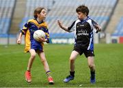 17 April 2019; Sarah Brennan, of Eastern Gaels GAA, Co. Mayo, in action against Dylan Dunican of Tubbercurry/Cloonacool GAA, Co. Sligo, during the Littlewoods Ireland Go Games Provincial Days in Croke Park. This year over 6,000 boys and girls aged between six and twelve represented their clubs in a series of mini blitzes and – just like their heroes – got to play in Croke Park, Dublin. Photo by Seb Daly/Sportsfile