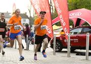 18 April 2019; Lisa Brennan of Kilkenny City Harriers, Co. Kilkenny, left, and Don Egan during the Kia Race Series Streets of Kilkenny 5k in Kilkenny City.  Photo by Harry Murphy/Sportsfile