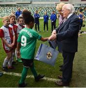 19 April 2019; The President of Ireland Michael D Higgins and his wife Sabina with players from Cliftonville FC and Linfield FC girls under 9 teams during his visit to the Irish Football Association Headquarters at the National Football Stadium in Windsor Park, Belfast. Photo by Oliver McVeigh/Sportsfile