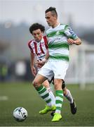 19 April 2019; Aaron McEneff of Shamrock Rovers in action against Barry McNamee of Derry City during the SSE Airtricity League Premier Division match between Derry City and Shamrock Rovers at the Ryan McBride Brandywell Stadium in Derry. Photo by Stephen McCarthy/Sportsfile