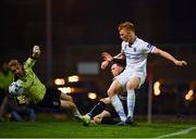 19 April 2019; Daniel Grant of Bohemians shoots to score his side's third goal, despite the attempts of Conor Kearns and Liam Scales of UCD, during the SSE Airtricity League Premier Division match between Bohemians and UCD at Dalymount Park in Dublin. Photo by Seb Daly/Sportsfile