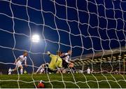 19 April 2019; Daniel Grant of Bohemians shoots to score his side's third goal, despite the attempts of Conor Kearns and Liam Scales of UCD, during the SSE Airtricity League Premier Division match between Bohemians and UCD at Dalymount Park in Dublin. Photo by Seb Daly/Sportsfile