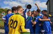 21 April 2019; Ewan O'Brian of Limerick lifts the trophy following the FAI Youth Interleague Cup Final between Limerick and Waterford at Jackman Park in Limerick. Photo by Harry Murphy/Sportsfile