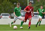 25 April 2019; Ross Tierney of Republic of Ireland in action against Dylan Rhys Jones of Wales during the SAFIB Centenary Shield Under 18 Boys’ International match between Republic of Ireland and Wales at Home Farm FC in Whitehall, Dublin. Photo by Matt Browne/Sportsfile