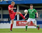 25 April 2019; Oliver Lanceley of Wales in action against James Clarke of Republic of Ireland during the SAFIB Centenary Shield Under 18 Boys’ International match between Republic of Ireland and Wales at Home Farm FC in Whitehall, Dublin. Photo by Matt Browne/Sportsfile