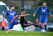 26 April 2019; Ali Reghba of Bohemians is fouled by Damien Delaney of Waterford during the SSE Airtricity League Premier Division match between Bohemians and Waterford at Dalymount Park in Dublin. Photo by Sam Barnes/Sportsfile