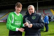 27 April 2019; Sean Quinlivan, Blarney United receives the Player of the Match award from Noel Fitzroy, Vice-President of the FAI, after the game. FAI Under-17 Cup Final match between St Kevin’s Boys and Blarney United at Dalymount Park in Dublin. Photo by Barry Cregg/Sportsfile
