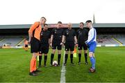 27 April 2019; Referee Dylan Redmond tosses a coin between St. Kevin's Boys captain Killian Philips, left, and Blarney United captain Zack McCarthy ahead of the game. FAI Under-17 Cup Final match between St Kevin’s Boys and Blarney United at Dalymount Park in Dublin. Photo by Barry Cregg/Sportsfile