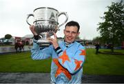 30 April 2019; Jockey Paul Townend celebrates with the cup after winning the BoyleSports Champion Steeplechase on Un De Sceaux at Punchestown Racecourse in Naas, Kildare. Photo by David Fitzgerald/Sportsfile