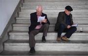 2 May 2019; Racegoers Jock, left, and PJ Quirke from Ashton, Co Tipperary, study the form prior to racing during the Champion Stayers Hurdle day at Punchestown Racecourse in Naas, Kildare. Photo by David Fitzgerald/Sportsfile