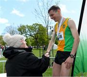 4 May 2019; Athletics Ireland President Georgina Drumm presents Conor Duffy of Glaslough Harriers A.C. Monaghan, with his medal after the AAI Men's National 5k Championship at the Irish Runner 5k in conjunction with the AAI National 5k Championships, Phoenix Park in Dublin. Photo by Brendan Moran/Sportsfile