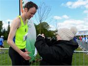 4 May 2019; Athletics Ireland President Georgina Drumm presents Peter Arthur of Liffey Valley A.C. in Dublin, with his medal after the AAI Men's National 5k Championship at the Irish Runner 5k in conjunction with the AAI National 5k Championships, Phoenix Park in Dublin. Photo by Brendan Moran/Sportsfile