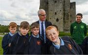 7 May 2019; International team managers Mick McCarthy and Colin Bell visited Trim Castle and the Knightsbrook Hotel today to officially launch the 2019 Football Association of Ireland AGM and Festival of Football. The Royal County will host both events for the first time at the end of July, culminating with the Association’s AGM at the popular Knightsbrook hotel on Saturday, July 27th. All 38 clubs in Meath will receive visits from FAI management, former internationals and coaching staff during the week long festivities. Clubs will also benefit from financial aid and coaching assistance as Meath becomes the 13th host of the Festival of Football which launched in 2007. This year’s Festival is supported by Meath County Council and the Meath Local Sports Partnership. Republic of Ireland manager Mick McCarthy with pupils of 4th Class in St Anne's Loreto Primary School, Navan. Photo by Stephen McCarthy/Sportsfile