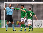 9 May 2019; Republic of Ireland players Andrew Omobamidele and Joe Hodge, 6, appeal to referee Krzysztof Jakubik after he pulled them back from restarting the game too quickly during the 2019 UEFA European Under-17 Championships Group A match between Belgium and Republic of Ireland at Tallaght Stadium in Dublin. Photo by Stephen McCarthy/Sportsfile