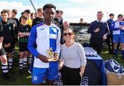 11 May 2019; Gemma McGurk, Regional Manager of Sketchers, right, presents the player of the match trophy to Eric Yoro of Stella Maris following the U15 SFAI Cup Final 2019 match between Stella Maris and Hanover Harps at Oscar Traynor Centre in Dublin. Photo by Michael P. Ryan/Sportsfile