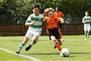 11 May 2019; Chris Conlon of St Kevin's Boys in action against Marven Chan of Shamrock Rovers during the U12 SFAI Cup Final 2019 match between Shamrock Rovers and St Kevin's Boys at Oscar Traynor Centre in Dublin. Photo by Michael P. Ryan/Sportsfile