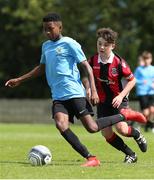 11 May 2019; Samuel Soyemi of Belvedere FC in action against Callum Wynne of Cherry Orchard during the U14 SFAI Cup Final match between Belvedere FC and Cherry Orchard at Oscar Traynor Centre in Dublin. Photo by Michael P. Ryan/Sportsfile