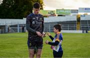 11 May 2019; Tipperary goalkeeper Evan Comerford signs an autograph for Tipperary supporter Ciarán Cassidy, aged 10, from Thurles, after the Munster GAA Football Senior Championship quarter-final match between Tipperary and Limerick at Semple Stadium in Thurles, Co. Tipperary. Photo by Diarmuid Greene/Sportsfile