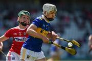 12 May 2019; Ed Connolly of Tipperary in action against Paul O'Riordan of Cork during the Electric Ireland Munster Minor Hurling Championship match between Cork and Tipperary at Pairc Ui Chaoimh in Cork. Photo by Diarmuid Greene/Sportsfile