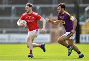 12 May 2019; John Clutterbuck of Louth in action against Conor Devitt of Wexford during the Leinster GAA Football Senior Championship Round 1 match between Wexford and Louth at Innovate Wexford Park in Wexford.   Photo by Matt Browne/Sportsfile