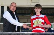 12 May 2019; Paul Gallagher of Sketchers Ireland presents the player of the match to Luke Kehir of Leixlip United following the U13 SFAI Cup Final 2019 match between Douglas Hall and Leixlip United at Turners Cross in Cork. Photo by Michael P. Ryan/Sportsfile