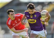 12 May 2019; Conor Devitt of Wexford in action against Fergal Donohoe of Louth during the Leinster GAA Football Senior Championship Round 1 match between Wexford and Louth at Innovate Wexford Park in Wexford.   Photo by Matt Browne/Sportsfile