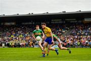 12 May 2019; Conor Devaney of Roscommon in action against Dean McGovern of Leitrim during the Connacht GAA Football Senior Championship Quarter-Final match between Roscommon and Leitrim at Dr Hyde Park in Roscommon. Photo by Seb Daly/Sportsfile
