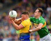 12 May 2019; Conor Cox of Roscommon in action against Micheal McWeeney of Leitrim during the Connacht GAA Football Senior Championship Quarter-Final match between Roscommon and Leitrim at Dr Hyde Park in Roscommon. Photo by Seb Daly/Sportsfile