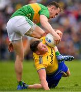 12 May 2019; Conor Cox of Roscommon in action against Micheal McWeeney of Leitrim during the Connacht GAA Football Senior Championship Quarter-Final match between Roscommon and Leitrim at Dr Hyde Park in Roscommon. Photo by Seb Daly/Sportsfile