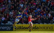 12 May 2019; Patrick Horgan of Cork shoots to score his side's seventeenth point despite the efforts of Cathal Barrett of Tipperary during the Munster GAA Hurling Senior Championship Round 1 match between Cork and Tipperary at Pairc Ui Chaoimh in Cork. Photo by Diarmuid Greene/Sportsfile