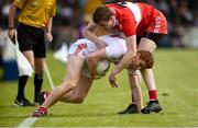 12 May 2019; Peter Harte of Tyrone in action against Brendan Rogers of Derry during the Ulster GAA Football Senior Championship preliminary round match between Tyrone and Derry at Healy Park, Omagh in Tyrone. Photo by Oliver McVeigh/Sportsfile