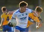 11 May 2019; Conor Murray of Waterford in action against Aaron Fitzgerald of Clare during the Munster GAA Football Senior Championship quarter-final match between Clare v Waterford at Cusack Park in Ennis, Clare. Photo by Sam Barnes/Sportsfile