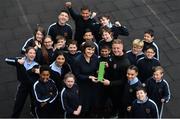 15 May 2019; James Talbot of Bohemians is presented with his SSE Airtricity/SWAI Player of the Month award for April by SSE Airtricity Digital Marketing Lead Ruth Ryan in the company of students from 5th and 6th class in St Gabriel's National School in Stoneybatter, Dublin. Photo by Brendan Moran/Sportsfile
