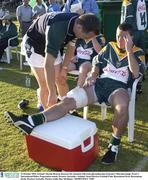 21 October 2003; Ireland's Declan Browne discusses his situation with team physiotherapist Eamonn î Muircheartaigh. Foster's International Rules, Preparation match, Western Australia v Ireland, Swan Districts Football Club, Bassendean Oval, Bassendean, Perth, Western Australia. Picture credit; Ray McManus / SPORTSFILE *EDI*