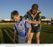 21 October 2003; Kevin Hughes, Ireland, signs a Dublin jersey worn by Dublin born namesake Kevin Hughes. Kevin is now a resident of Riverdale, Perth. Foster's International Rules, Preparation match, Western Australia v Ireland, Swan Districts Football Club, Bassendean Oval, Bassendean, Perth, Western Australia. Picture credit; Ray McManus / SPORTSFILE *EDI*      NOTE to Sub Editor; both names are correct.