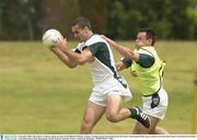 22 October 2003; Sean Marty Lockhart, under pressure from Odhran O'Dwyer, during a training session in preparation for the Foster's International Rules game between Australia and Ireland, Swan Districts Football Club, Bassendean Oval, Bassendean, Perth, Western Australia. Picture credit; Ray McManus / SPORTSFILE *EDI*