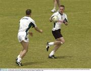 22 October 2003; Cormac McAnallen takes a pass from Paul McGrane during a training session in preparation for the Foster's International Rules game between Australia and Ireland, Swan Districts Football Club, Bassendean Oval, Bassendean, Perth, Western Australia. Picture credit; Ray McManus / SPORTSFILE *EDI*