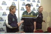 23 October 2003; The Irish manager John O'Keeffe smiles as Australian captain Shane Crawford and Irish captain Graham Canty greet each other after the press conference, in advance of the Foster's International Rules game between Australia and Ireland, at the Sheraton-Perth Hotel, Perth, Western Australia. Picture credit; Ray McManus / SPORTSFILE *EDI*