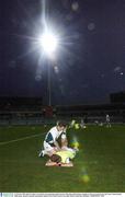 22 October 2003; Benny Coulter is assisted by team physiotherapist Eamonn î Muircheartaigh during a training session in preparation for the Foster's International Rules game  between Australia and Ireland, Subiaco Oval, Perth, Western Australia. Picture credit; Ray McManus / SPORTSFILE *EDI*