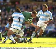 26 October 2003; Eric Miller, Ireland, in action against Roberto GHrau, (1), and Gonzalo Longo, Argentina. 2003 Rugby World Cup, Pool A, Ireland v Argentina, Adelaide Oval, Adelaide, South Australia, Australia. Picture credit; Brendan Moran / SPORTSFILE *EDI*