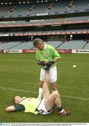28 October 2003; Benny Coulter gets some assistance from Ger Power during a training session in prepatation for the Fosters International Rules game between Australia and Ireland. Melbourne Cricket Grounds, Melbourne, Australia. Picture credit; Ray McManus / SPORTSFILE *EDI*