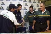 29 October 2003; Opposing captains Graham Canty and Shane Crawford, left, shake hands as they and Australian coach Gary Lyon and Irish manager John O'Keeffe prepare to leave the final press conference in advance of the Fosters International Rules second test between Australia and Ireland. Telstra Stadium, Melbourne, Australia. Picture credit; Ray McManus / SPORTSFILE *EDI*