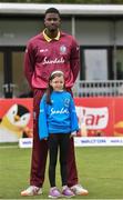15 May 2019; Jason Holder of West Indies with mascot Christina Troup, aged 6, ahead of the One-Day International Tri-Series Final match between West Indies and Bangladesh at Malahide Cricket Ground, Malahide, Dublin. Photo by Sam Barnes/Sportsfile