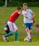 13 May 2019; Robert Navarro Muñoz of Spain in action against Patrick Posztobányi of Hungary during the 2019 UEFA European Under-17 Championships Quarter-Final match between Hungary and Spain at UCD Bowl in Dublin. Photo by Ben McShane/Sportsfile