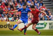 18 May 2019; Joey Carbery of Munster kicks under pressure from Robbie Henshaw of Leinster during the Guinness PRO14 semi-final match between Leinster and Munster at the RDS Arena in Dublin. Photo by Harry Murphy/Sportsfile