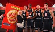 18 May 2019; Karen Hurley, Senior Brand Manager, Hula Hoops, presents the trophy to Shane O’Connor, Daniel Stewart, Tomas Banys, and Conall Mullan of Ulster University Elks Basketball after the won the Mens Final at the second annual Hula Hoops 3x3 Basketball Championships at Bray Seafront in Co. Wicklow. Photo by Ray McManus/Sportsfile