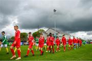 19 May 2019; Both teams walk out ahead of the Under 12 SFAI Subway Championship Final match between Donegal and Cork at Mullingar Athletic in Gainstown, Westmeath. Photo by Ramsey Cardy/Sportsfile